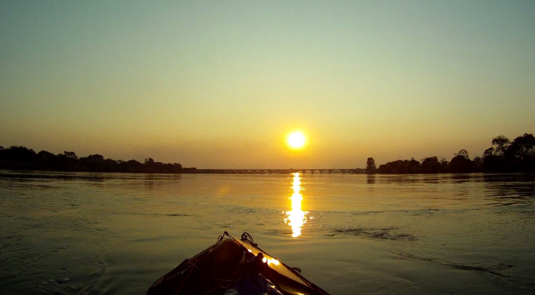 14f. Sunset with boat at malanje bridge.JPG